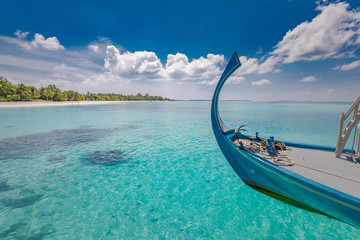 Maldives island background, amazing exotic landscape of blue turquoise sea view with horizon and wooden boat from Maldives, Dhoni. Sea tourism transportation for holiday and vacation in Maldives coast