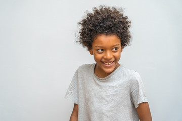 Curly Haired Black Boy Laughs Out Loud Copy Space On Gray Background Wall Mural Danillaophoto curly haired black boy laughs out loud
