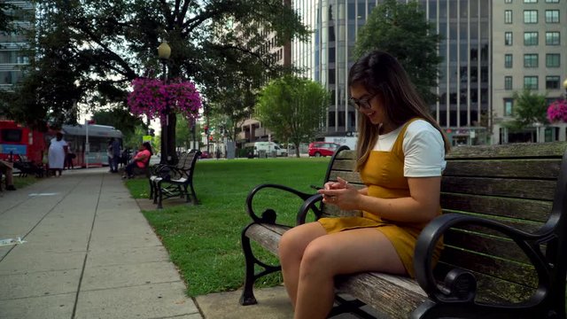 4k Young Asian Woman Laughing at TikTok videos on her phone