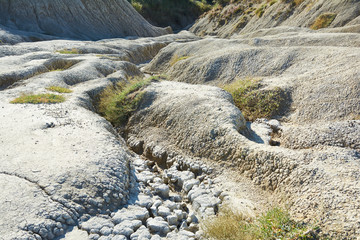 Muddy volcanoes Paclele Mari near Buzau, Romania. Mud and natural-gas eruptions create small volcanoes in natural reserve.