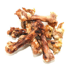 Small bones on a white background. food scraps. chicken bones