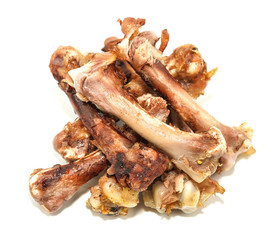 Small bones on a white background. food scraps. chicken bones