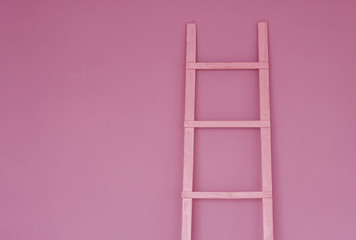 Pink staircase on pink wall background. Concept of women's success, career, self-education, development. Minimalism