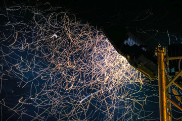 Flying insects playing in the light at night.