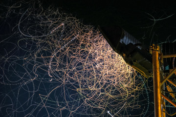 Flying insects playing in the light at night.