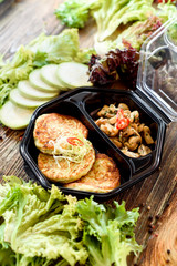 Zucchini pancakes with fried mushrooms. Take with you. Food delivery. Useful sports nutrition. Detox