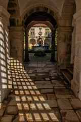 Fototapeta na wymiar Trellis Shadow On Monastery Stone Walkway, Tibaes Monastery, Portugal