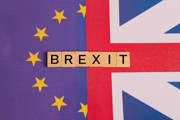 Concept of UK is on course to leave the EU, UK Brexit, European Union relations showing with flags.