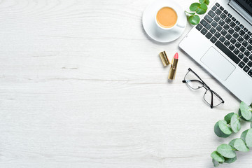 Women office desk. White wooden background.