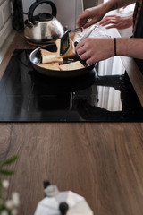 Close up of a frying pan with freshly made toasts