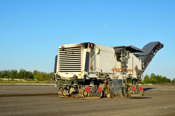 Cold milling machines are used for the quick, highly efficient removal of asphalt and concrete pavements. Removing and grinding the road surface, road construction and road rehabilitation - Image