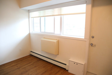 Winnipeg, Manitoba / Canada - September 22, 2019: Large window in a tiny living room.