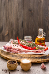 Raw pork ribs with rosemary, chili, garlic, salt and olive oil