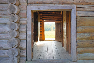  Open doors in a wooden house in the ancient village of Strochitsy Ozertso, Minsk region, Belarus.