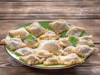 Close Up View of Fresh Homemade Ravioli on Wooden Background. With copy space. Soft focus.