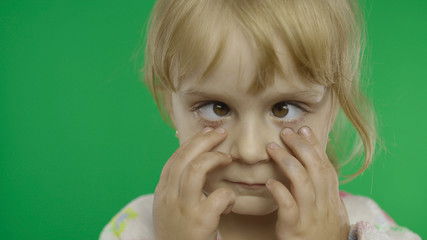 Pretty little child making crazy face with her eyes. Portrait. Chroma Key