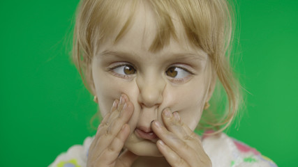 Pretty little child making crazy face with her eyes. Portrait. Chroma Key