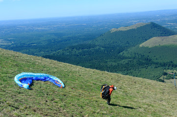 Paragliders preparing for takeoff at the summit of Puy de Dome volcano near Clermont-Ferrand