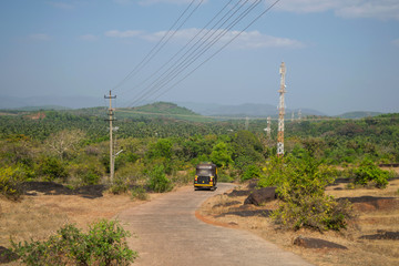 Tuk tuk on road of India, back view