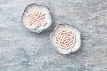 Vitamin B12 Supplement. Supports Metabolism and Nervous System Health. Rustic wooden background. Top view. Copy space. 