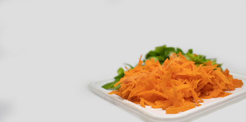 Sliced carrot and leeks on white background. Fresh sliced vegetables 