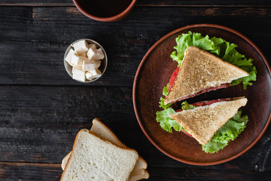 two slices of a sandwich on a plate, delicious breakfast for the whole family,