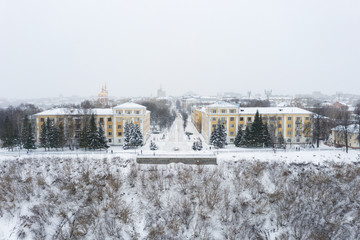 Kirov and the high bank of the river Vyatka and the Alexander Grin Embankment and the rotunda on a cloudy winter day