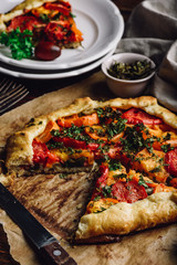 Sliced tomato galette on baking paper