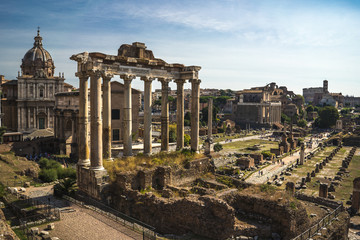 Fototapeta na wymiar Beautiful panoramic view On Roman Forum in Rome, Italy. Scenic view on Foro Romano in Rome, Colloseum is at the background
