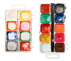 used palette of watercolor paints isolated on white background. art school concept. Colorful Messy Used Half Pan Paints