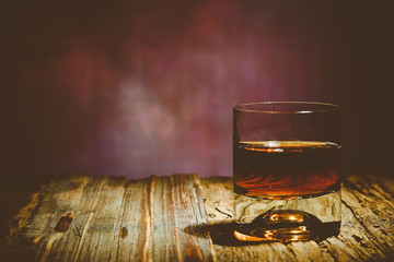 glass of whiskey on wooden