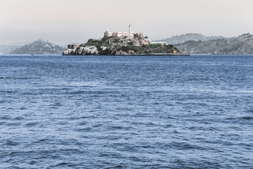 alcatraz prison during a summer day, view of the historic site of alcatraz in san francisco from the city pier during a summer day. united states - 294049442