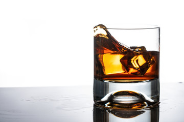 glass of whiskey with ice cubes