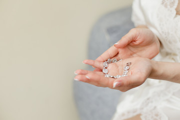 Woman's hands with perfect manicure with silver bracelet