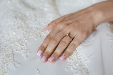 Bride's hands with lace veil 