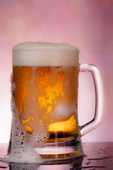 glass of beer with foam