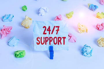 Handwriting text 24 Or 7 Support. Conceptual photo Giving assistance to service whole day and night No downtime Colored crumpled papers empty reminder white floor background clothespin