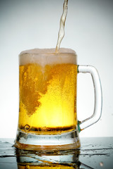 glass of beer with foam