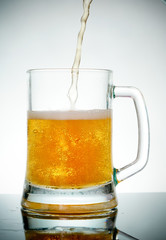glass of beer with foam