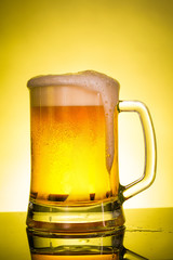 glass of beer with foam