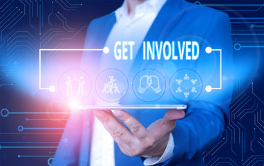 Text sign showing Get Involved. Business photo text Take part in an activity or event To establish an association Male human wear formal work suit presenting presentation using smart device