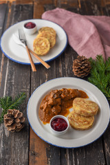 Deer goulash with dumplings and cranberry jam