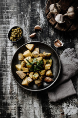 Herb Roasted Potatoes on a Dark Wooden Background