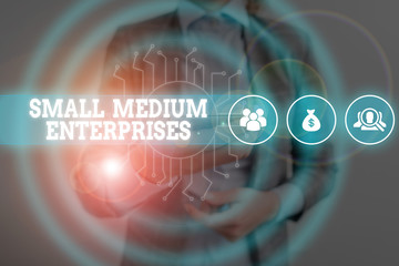 Writing note showing Small Medium Enterprises. Business concept for companies with less than...