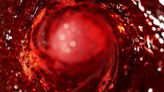 Super slow motion of pouring red wine in twister shape. Filmed on high speed cinema camera, 1000 fps.