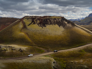 Two cars on the road to Landmannalaugar mountain