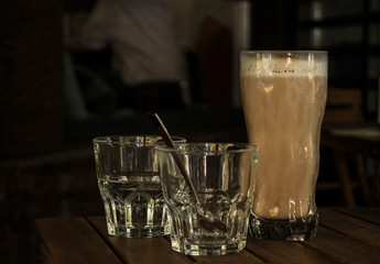 glass of coffee on black background