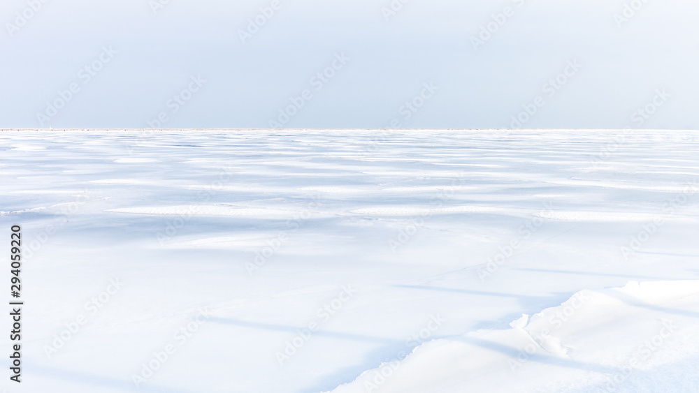 Wall mural plain white field covered in snow, arctic landscape