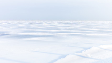 Plain white field covered in snow, arctic landscape