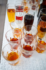 Glass glasses with drinks stand on a table